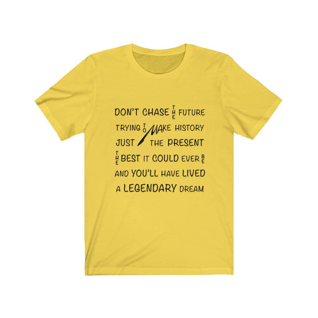 CHASING THE PRESENT - Yellow T-Shirt with black ink typography using vertical and horizontal text. Originating in the mind of Sir Real Words, brought to life by Sir Real Digital.